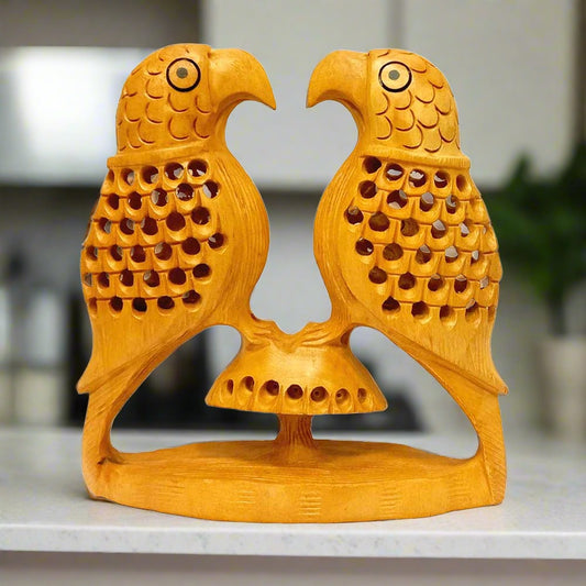 Handmade wooden undercut parrot with intricate lattice carving.