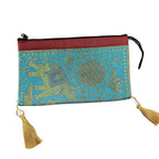 A luxurious silk potli bag with intricate zari embroidery, ideal for weddings and special events.