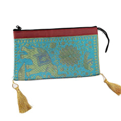 A luxurious silk potli bag with intricate zari embroidery, ideal for weddings and special events.