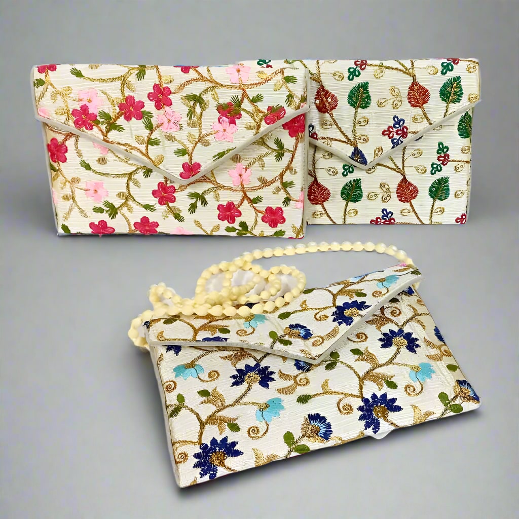 Elegant Zari and embroidery clutch bag with intricate detailing, perfect as a Navratri return gift