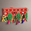 Front view of auspicious 11 green leaf bandarwal toran with sequins pearls tassels
