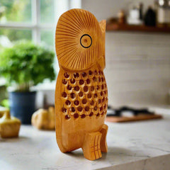 A 15cm tall wooden owl, a beautiful and decorative item.
