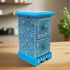 An 18cm beautiful wooden trinket box with two drawers and decorative knobs.