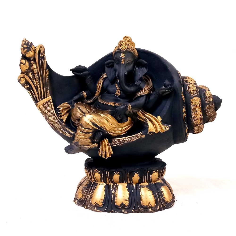 Showpiece of Ganesha sitting on conch shell