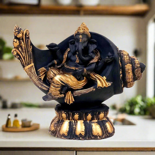 Showpiece of Ganesha sitting on conch shell