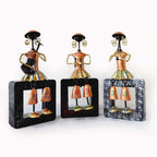 A 25cm metal musical doll set for table-top decor, decorated with beautiful and colorful painting.
