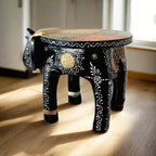 A 25cm wooden elephant showpiece that doubles as a stool, with beautiful emboss painting.