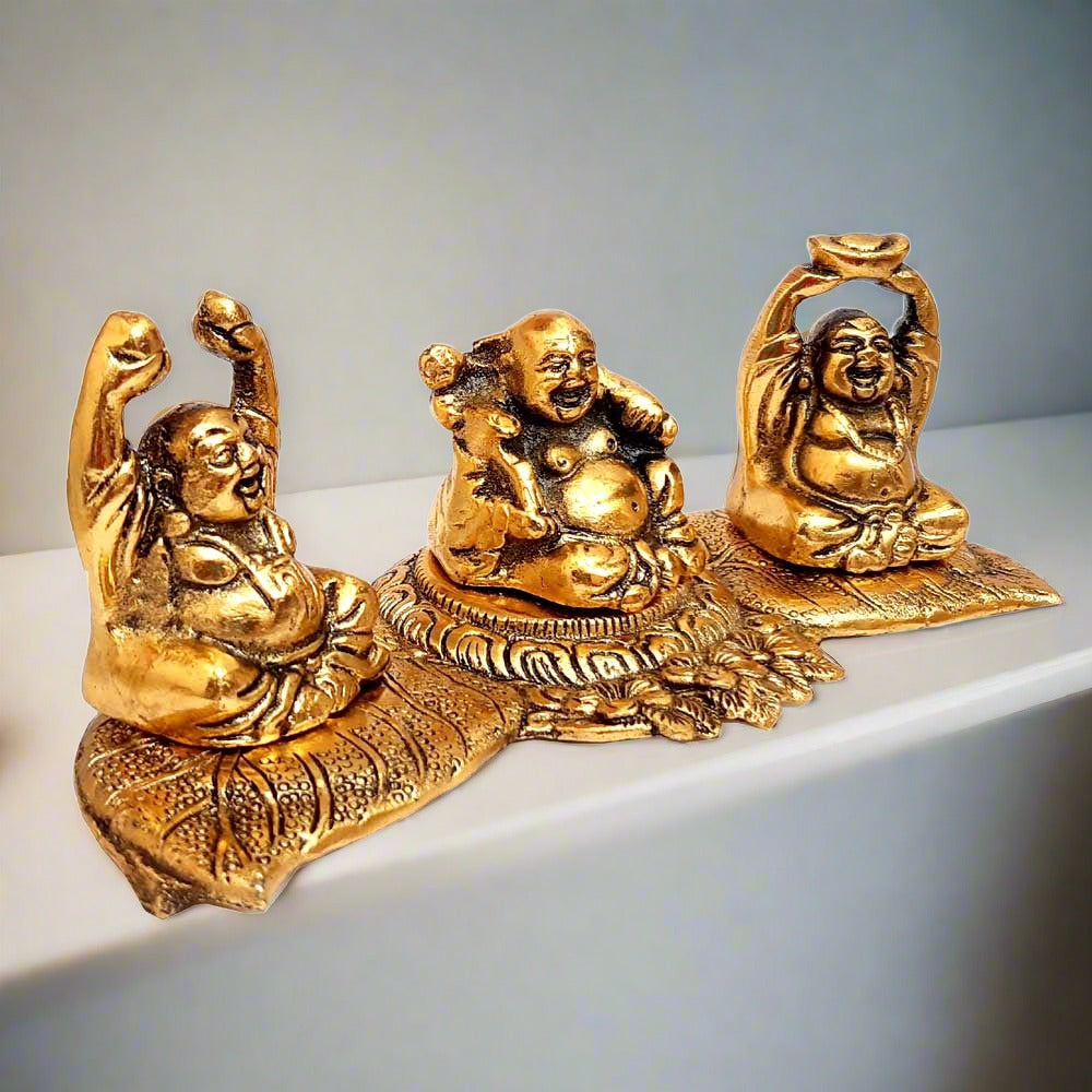 Set of 3 golden oxidized Laughing Buddha on leaf metal Vastu decor