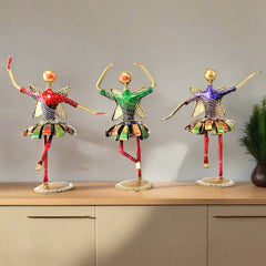 A 3-piece set of dancing dolls, a beautiful showpiece for a TV showcase or table decor.