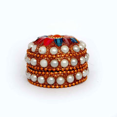 A 5cm round-shaped sindoor box with beautiful and excellent lac work.