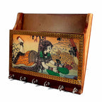 Closeup of 6 sturdy key hooks on gemstone painted wooden organizer.