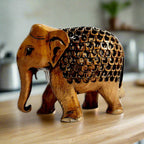 Handcrafted wooden elephant statue with brown oxidized finish and lattice design front view.