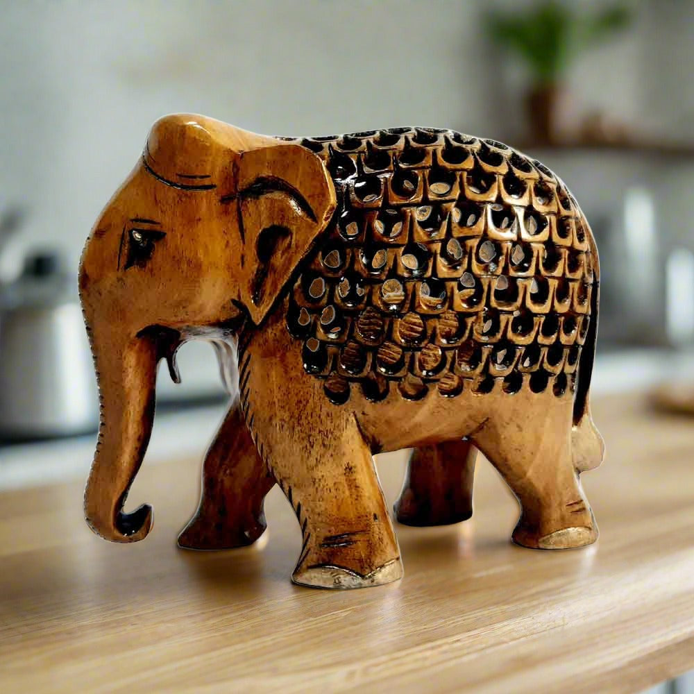 Handcrafted wooden elephant statue with brown oxidized finish and lattice design front view.