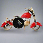 An antique, Royal Enfield bike-shaped desk clock and showpiece with beautiful hand painting.