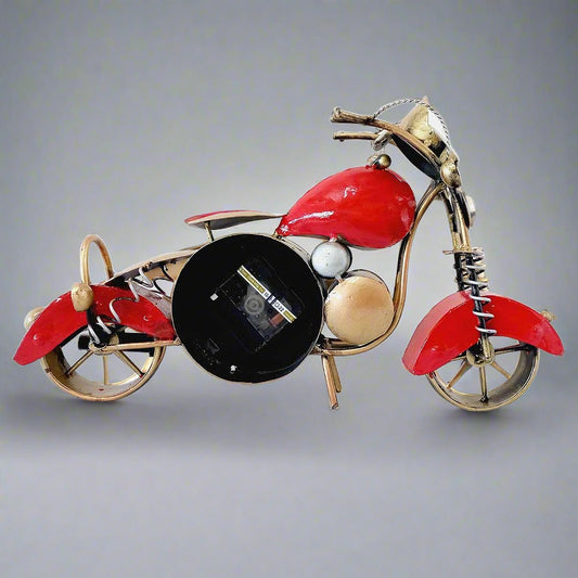 An antique, Royal Enfield bike-shaped desk clock and showpiece with beautiful hand painting.
