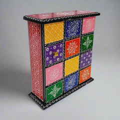 Artistic hand-painted wooden key box for organized key storage, suitable for home and office use.