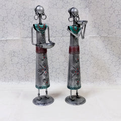Artistic tribal lady metal candle holders with silver oxidized finish and detailed emboss work, ideal for gifting and decoration.