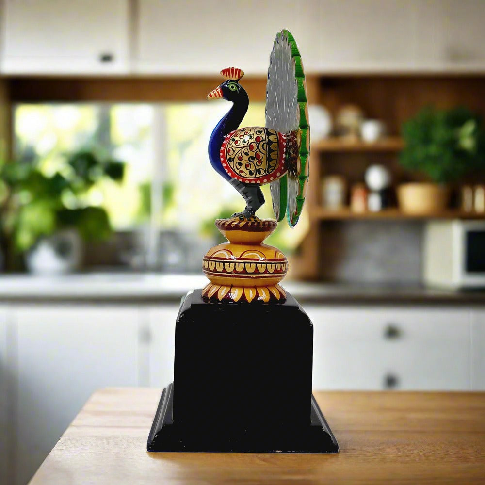 Artistic wooden peacock mounted on a platform, crafted from dried wood and enhanced with colorful hand painting.