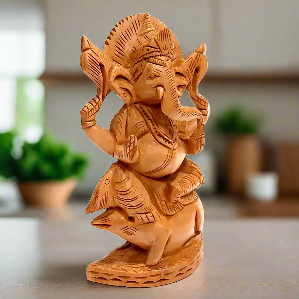  An auspicious wooden Ganesh idol for worship and home or office decor.