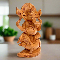  An auspicious wooden Ganesh idol for worship and home or office decor.