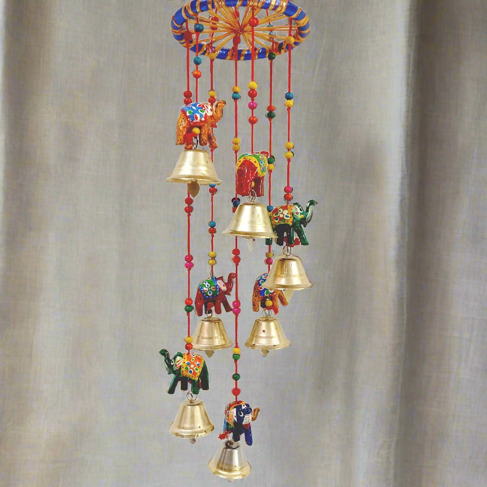 A beautiful papermache elephant toran with a design that attracts everyone's attention, featuring golden bells.