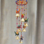 A beautiful papermache elephant toran with a design that attracts everyone's attention, featuring golden bells.