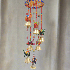 A beautiful papermache elephant toran with a design that attracts everyone's attention, featuring golden bells.