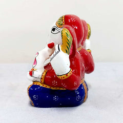 Ganesha idol with fine texture and meenakari hand painting, made of quality metal for gifting and home decor