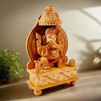 Wooden blessing Ganesha statue featuring a top side carved chattar and intricate wood carving.