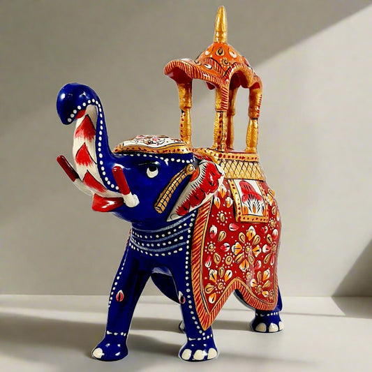 Stunning metal Ambabari elephant featuring blue enamel paint and red-orange meenakari decoration on the palanquin.
