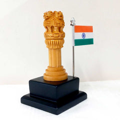 A small, well-made carved Ashoka Pillar replica with an Indian flag.