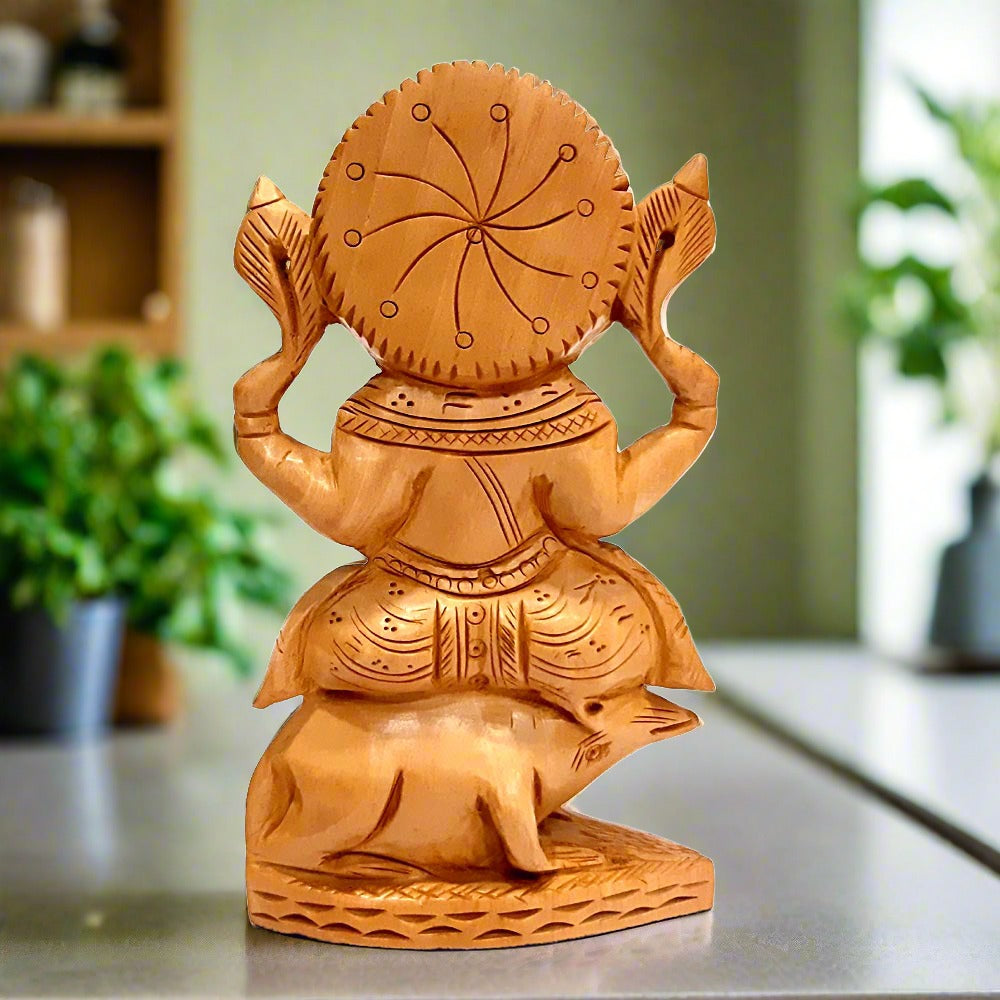 A carved Kadamba wood Ganpati murti, a completely handmade piece with wonderful workmanship.