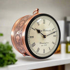 A classic railway clock with a metal stand, perfect for home and office decoration.