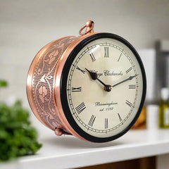 A classic railway clock with a metal stand, perfect for home and office decoration.