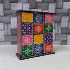 Colorful wooden key box with hand-painted designs, wall-mounted for easy access and stylish decor.