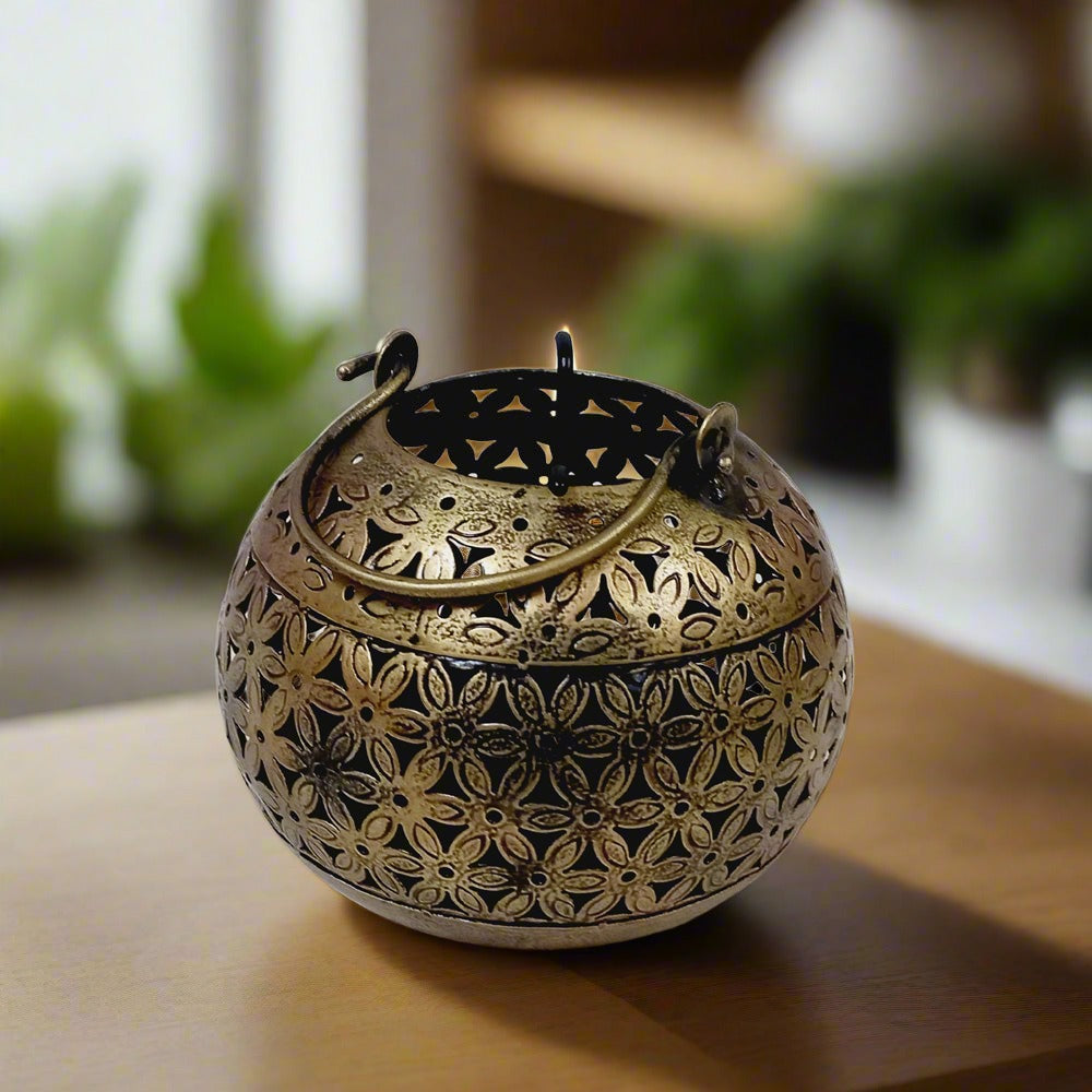 Decorative antique round metal candle stand with golden oxidized finish and mesh design, perfect for Diwali celebrations.