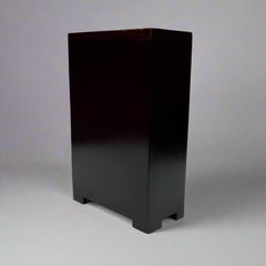 Decorative 3-layer drawer box in wood and metal with flower leaf design on antique metal front and top.