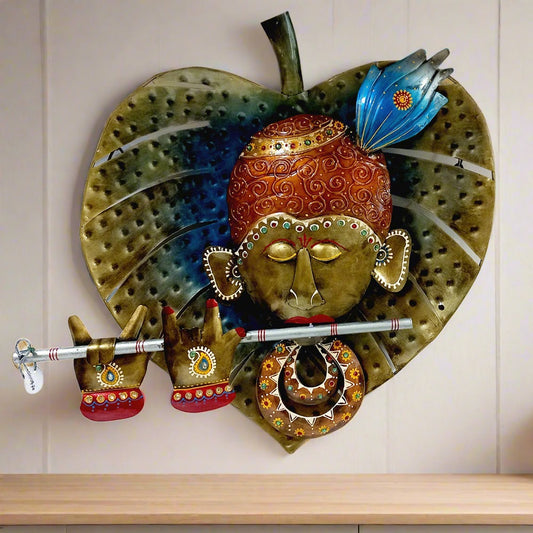 Decorative metal wall hanging of leaf Kishan ji with intricate hand painting, perfect for enhancing any wall space.