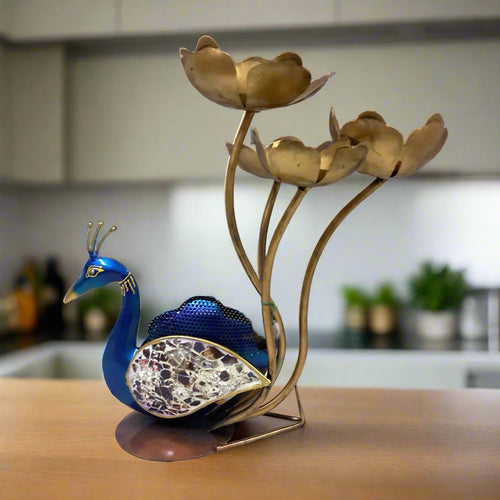 Decorative metal peacock candle holder showpiece with vibrant hand painting and glass-embellished feathers, holding four lotus candle stands.