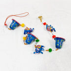Decorative toran with elephant and bells for wall decor.