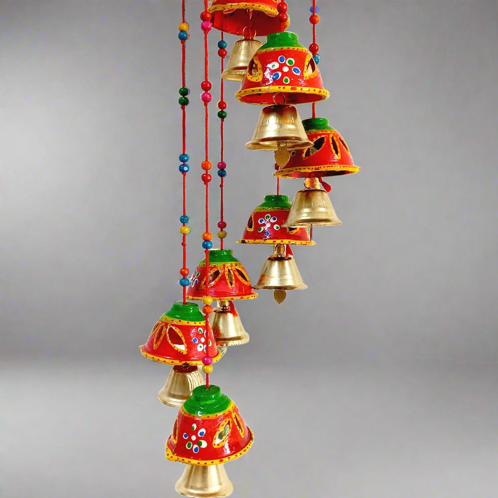 A decorative toran with a beautiful bell design, decorated with red, green, and yellow colors.