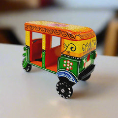 Decorative wooden auto rickshaw with beautiful hand painting, adding charm to home or office spaces.