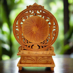 Decorative wooden Ganesh showpiece seated on a carved singhasan with undercut design and traditional motifs.