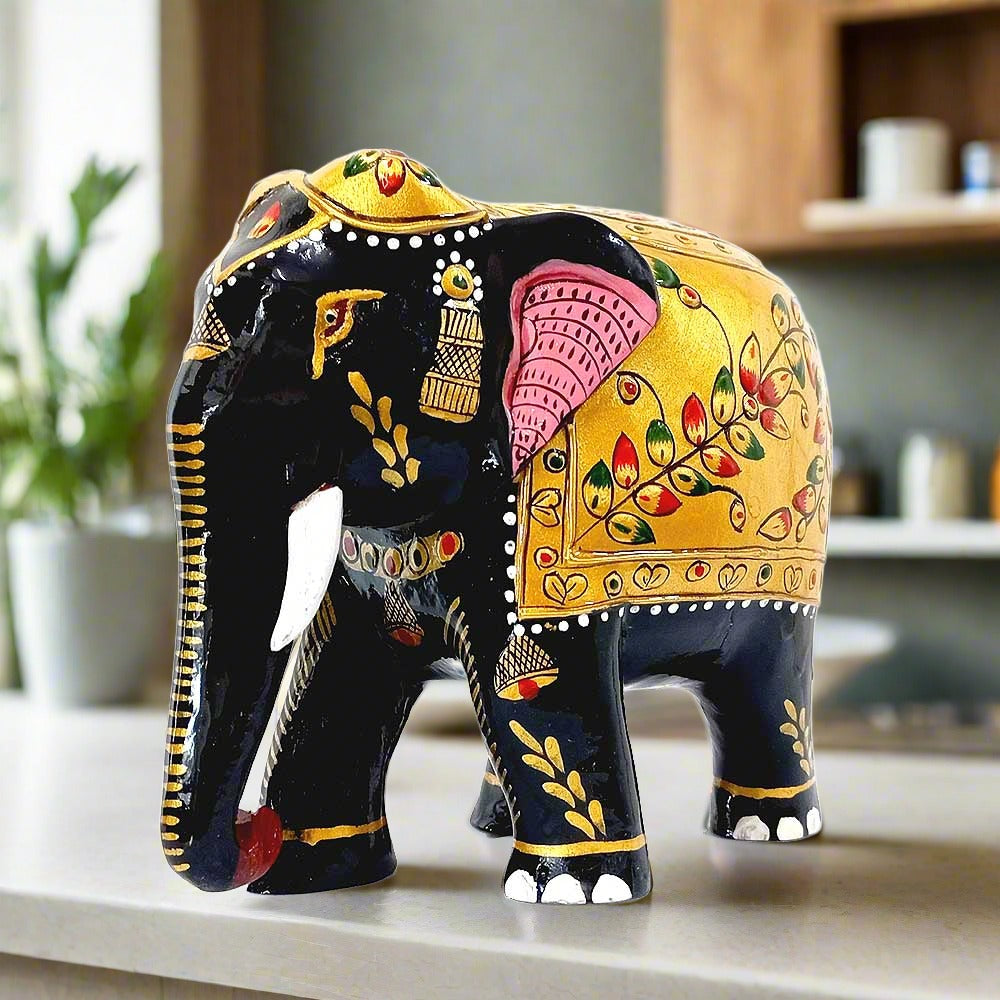 An amazing wooden elephant statue with a down trunk, made with an artisan's skill.