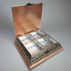 Open interior of copper oxidized box showing 4 partitions for dry fruits, chocolates, and sweets