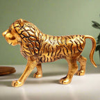 Side profile of Vastu lion statue with majestic golden polish detailing.
