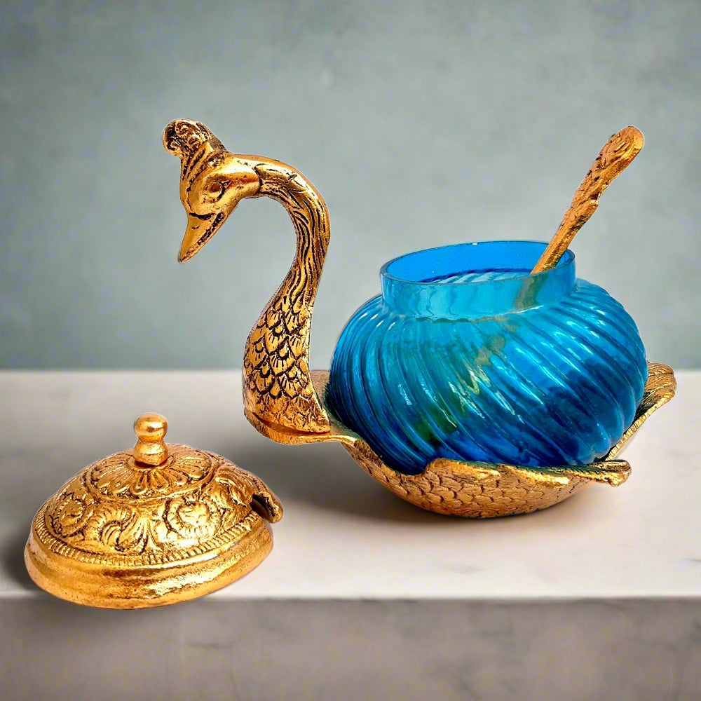 Elegant duck design bowl with glass and metal construction, supplied with a spoon for serving or gifting.