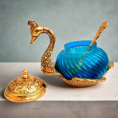 Elegant duck design bowl with glass and metal construction, supplied with a spoon for serving or gifting.