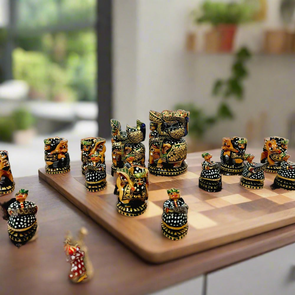 Elegant wooden chess set painted in red and green hues, combining luxury and traditional Indian art.