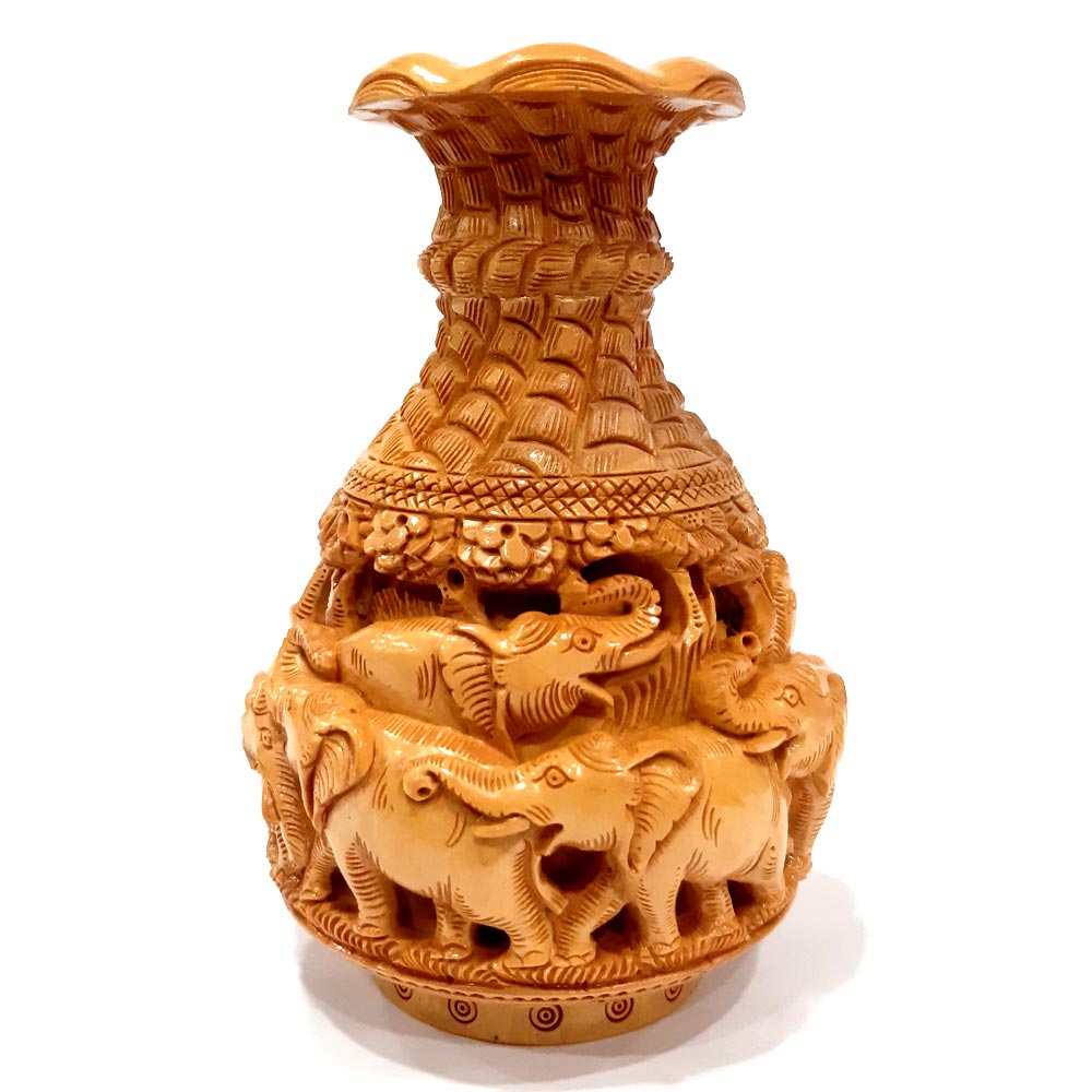 Kadamba elephant carving vase styled as antique home decor centerpiece.